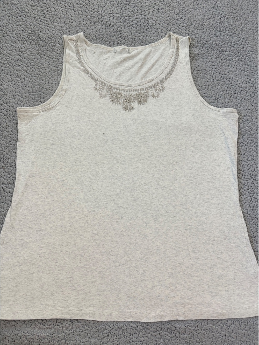Cream sleeveless embellished top